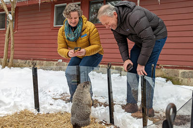A drawing by a pre-k student of two hearts and a hand
