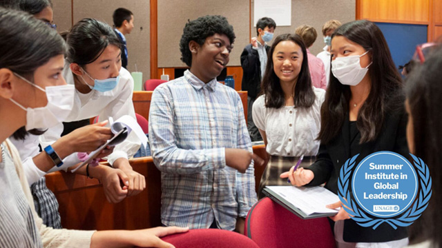 A drawing by a pre-k student of two hearts and a hand